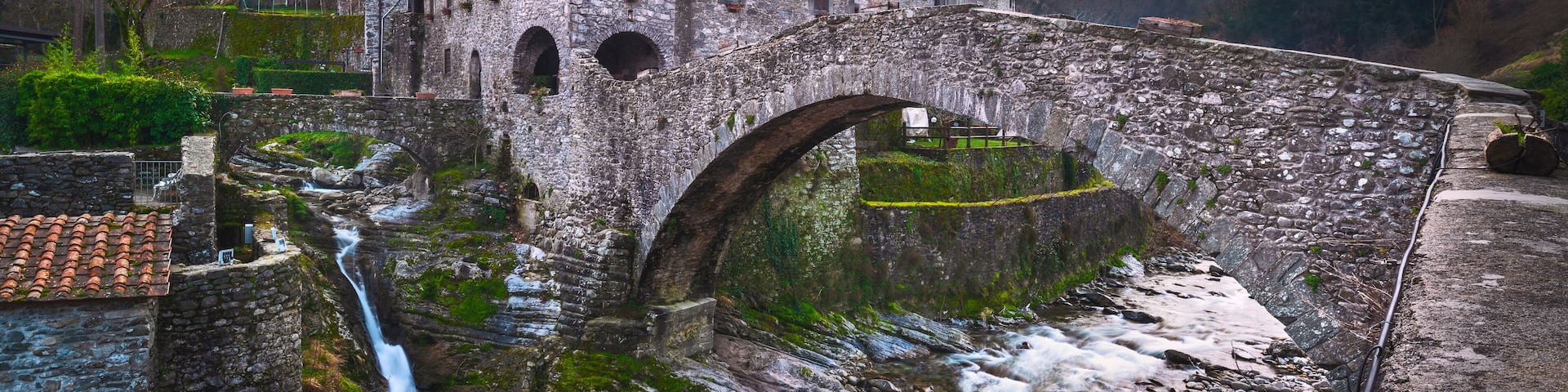 Fabbriche di Vallico ancient village and old bridge over the creek. Apuane park. Garfagnana, Tuscany, Italy.