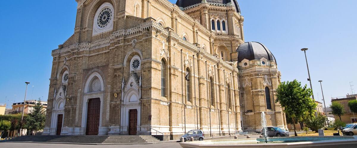 A historic church with a large dome and intricate facade.