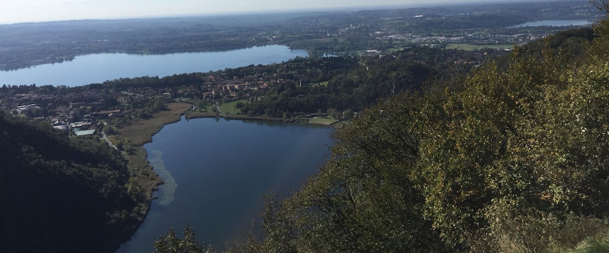 A lake surrounded by hills and a town.