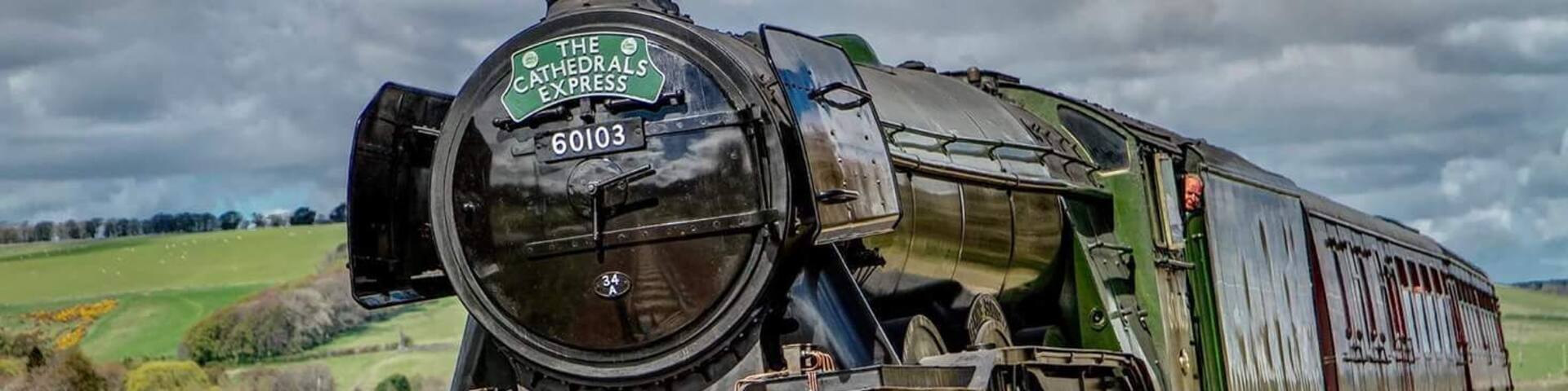 The Flying Scotsman, as it travels down through the Scottish Borders. Shot at a bend in the track, and staying safely on the right side of the safety fence