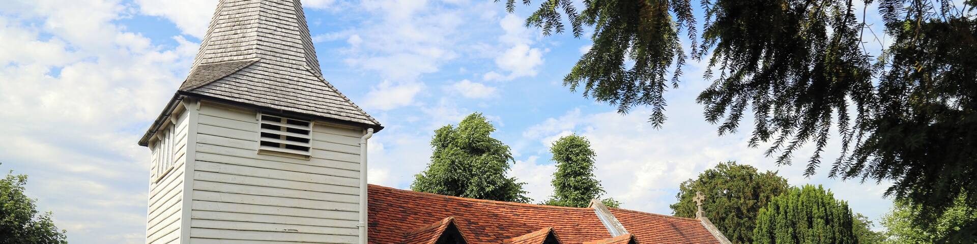 St Andrew's parish church, Greensted, in the civil parish of Ongar, Essex, England, seen from the churchyard footpath at the southwest