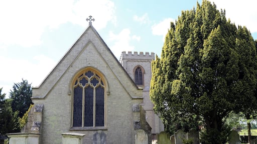 St Germain's parish church, Bobbingworth, Essex, England - chancel and tower from the east of the graveyard, with chest tombs and gravestones
