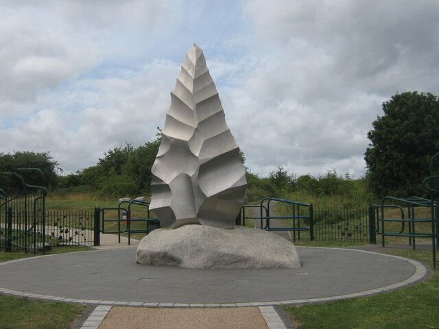 A modern sculpture in a park.