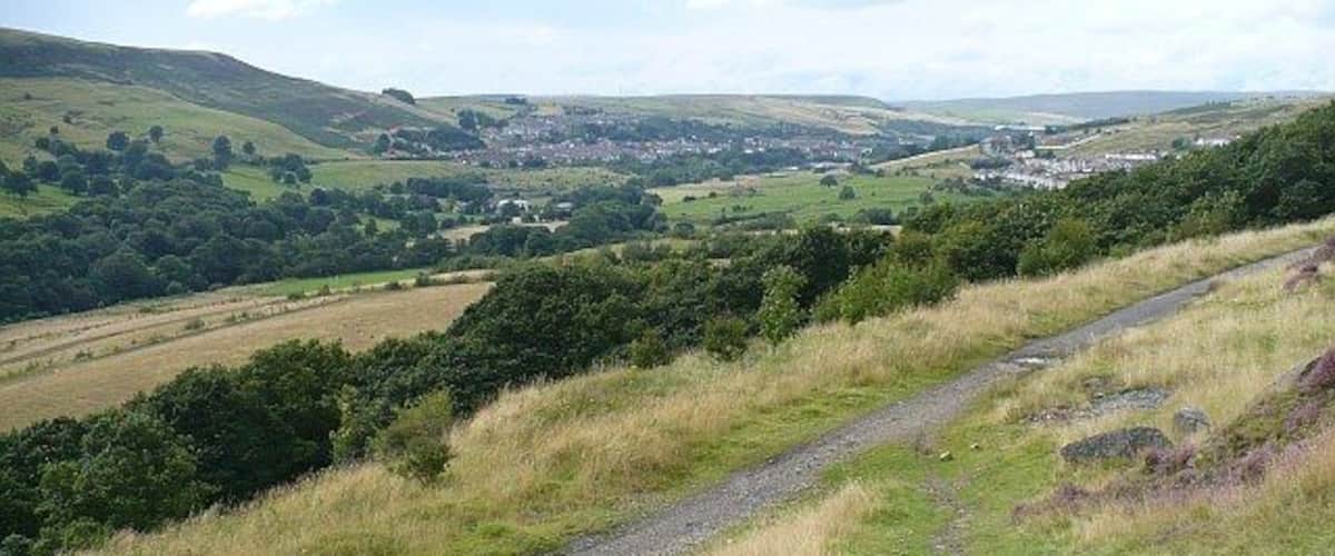 Upper Rhymney Valley. The view from 955781 showing the track from Abertysswg to Pontlottyn in the foreground. In the centre distance across the valley is Pontlottyn. On the right is Abertysswg.