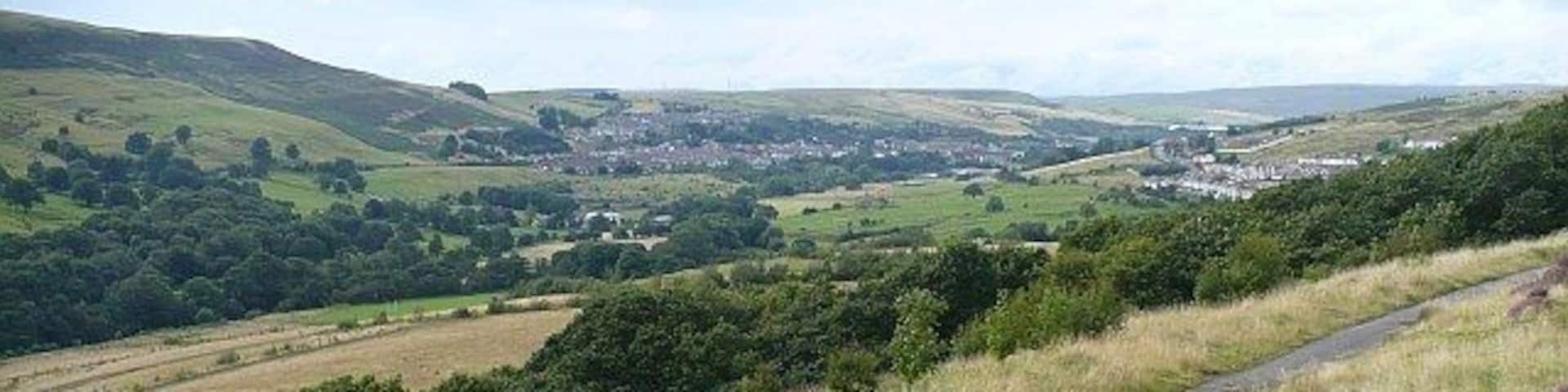 Upper Rhymney Valley. The view from 955781 showing the track from Abertysswg to Pontlottyn in the foreground. In the centre distance across the valley is Pontlottyn. On the right is Abertysswg.