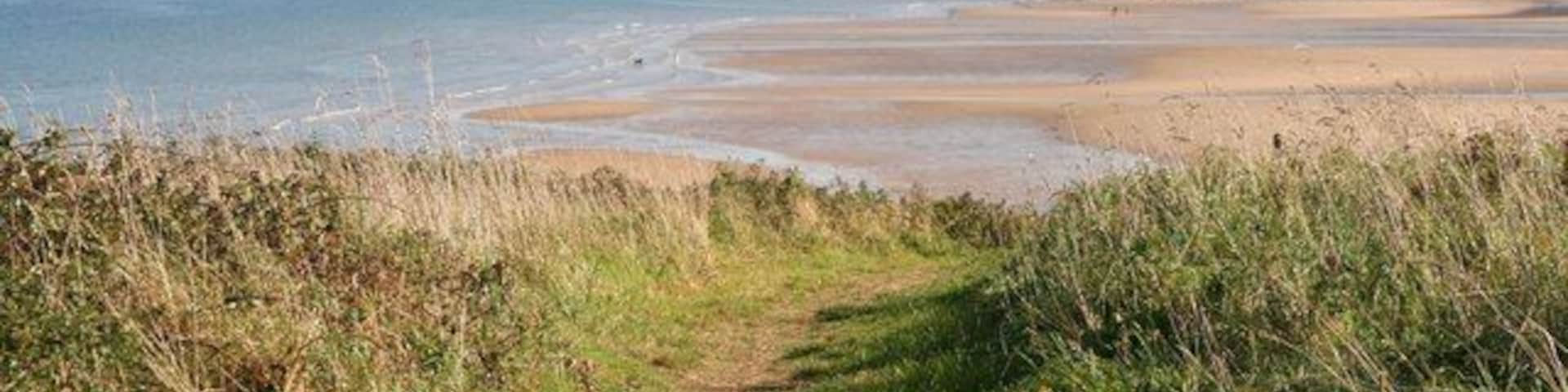Isle of Anglesey Coastal Path The path here heads down to the car parks near the beach.