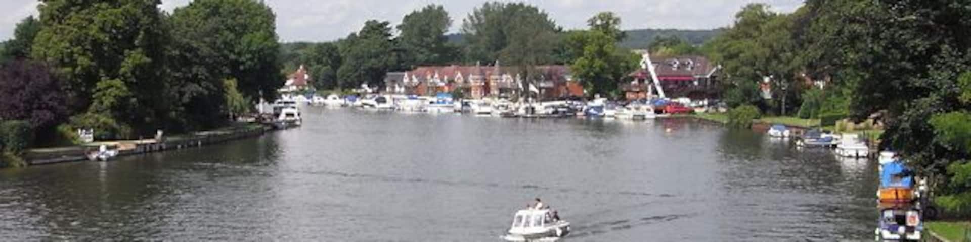 The River Thames, Bourne End The view upstream from the footbridge that accompanies the railway bridge. The footbridge carries a permissive footpath.