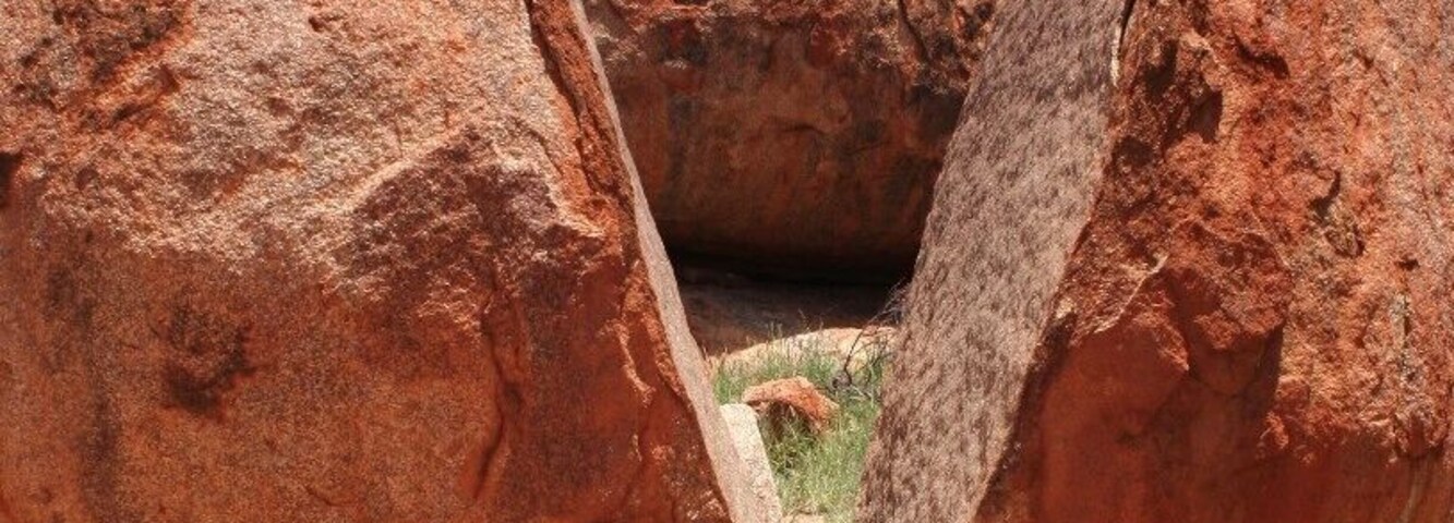 Crazy how a solid rock like this can just split.
http://prettypacked.wordpress.com/2014/07/31/playing-with-the-devils-marbles/