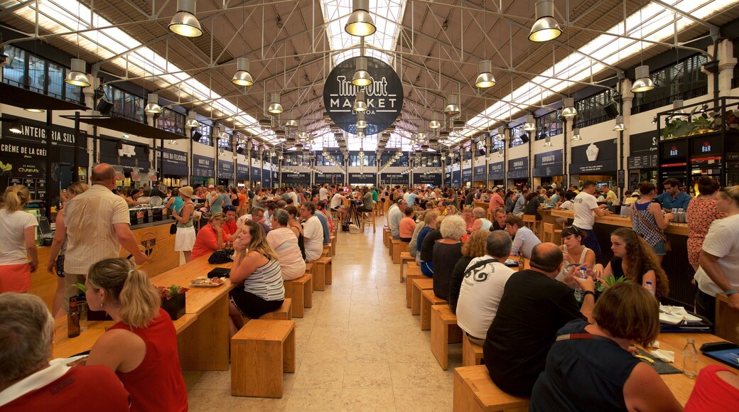 Lisbon which includes markets and interior views as well as a large group of people