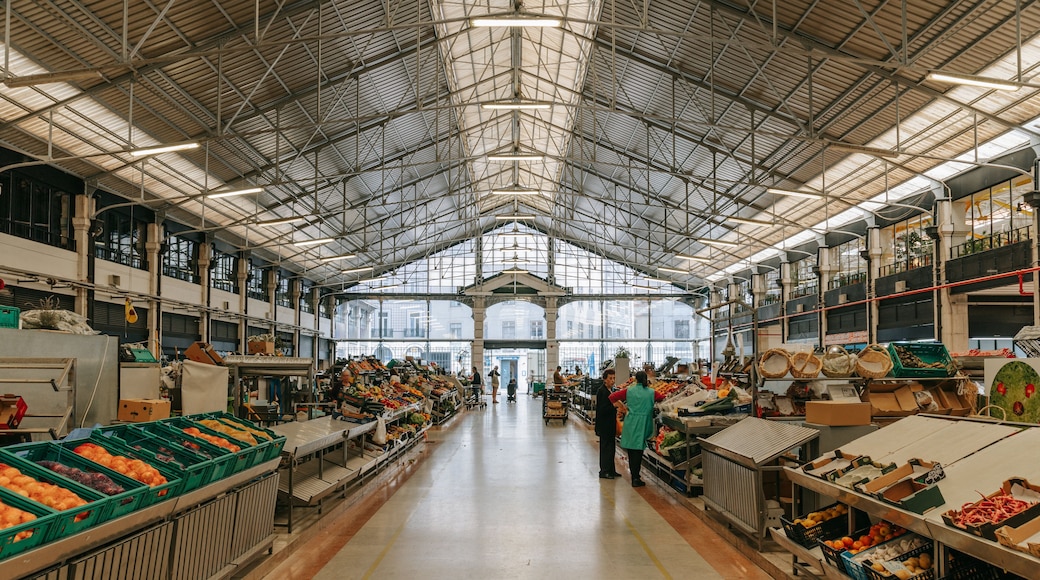Mercado da Ribeira featuring markets and interior views