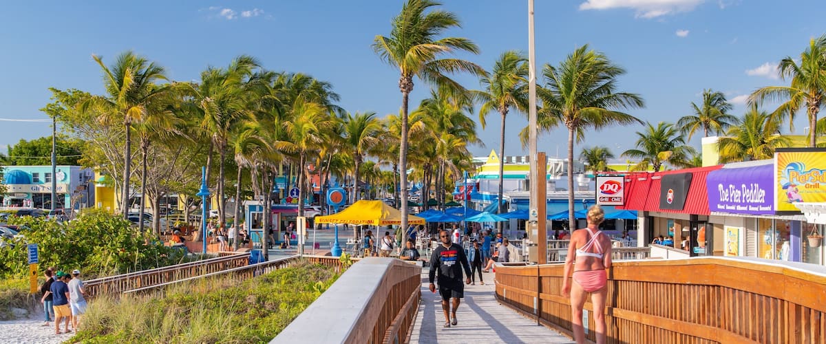 Fishing Pier Fort Myers Beach featuring a sandy beach and a bridge