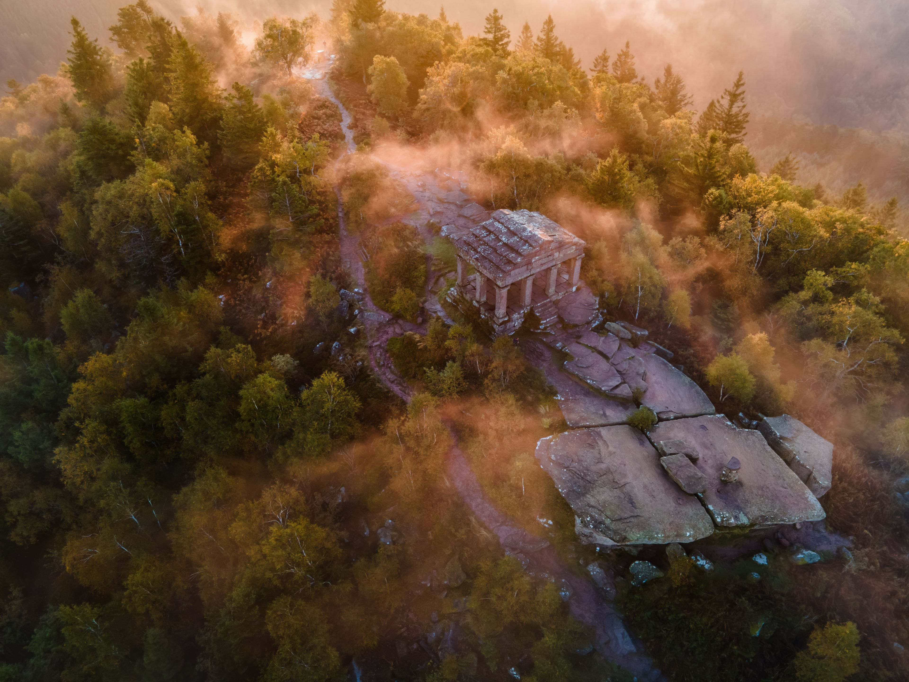 FRANCE ALSACE BAS-RHIN 67 GRANDFONTAINE. PERCHED ATOP THE DONON MASSIF, THE TEMPLE WATCHES OVER THE VOSGES RIDGES, AN ENIGMATIC SILHOUETTE EMERGING FROM A MISTY LANDSCAPE.