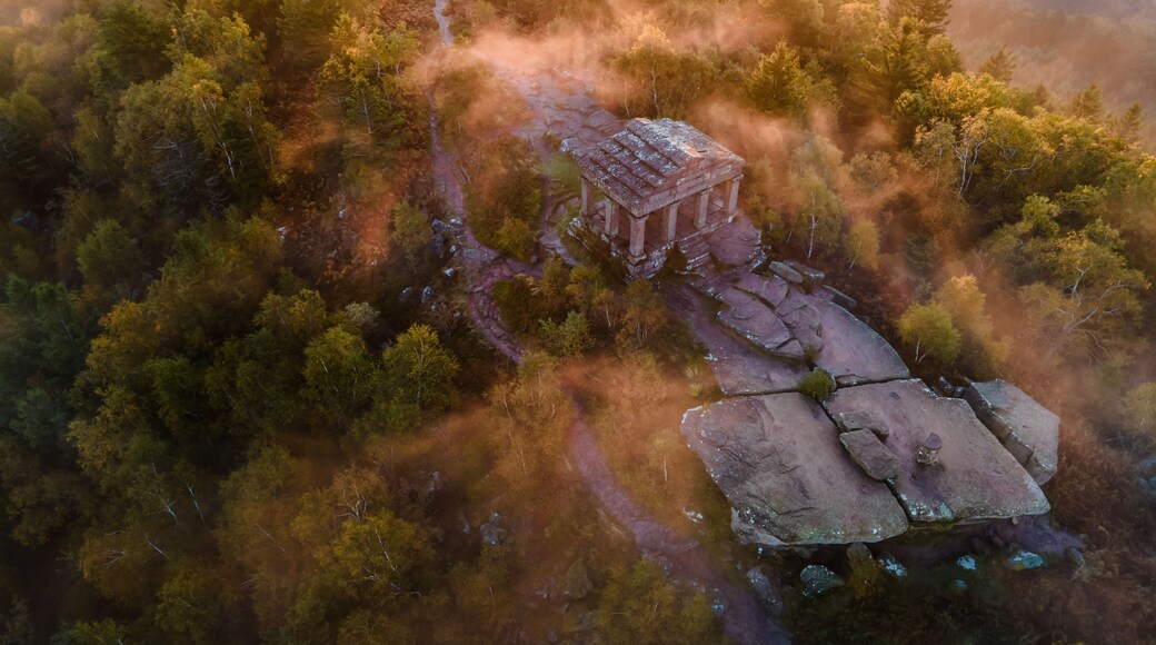 FRANCE ALSACE BAS-RHIN 67 GRANDFONTAINE. PERCHED ATOP THE DONON MASSIF, THE TEMPLE WATCHES OVER THE VOSGES RIDGES, AN ENIGMATIC SILHOUETTE EMERGING FROM A MISTY LANDSCAPE.