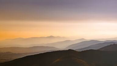 A mountain range with a misty atmosphere.