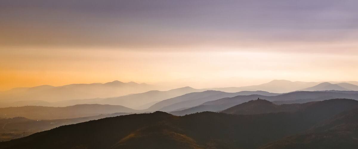 A mountain range with a misty atmosphere.