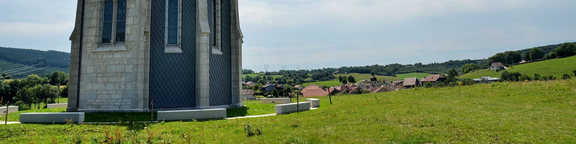 The chapel Notre Dame des Anges at Ouhans (the village can be seen in the background) Jura