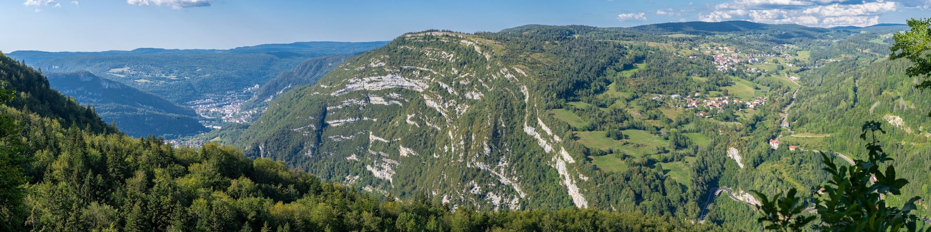 Belvedere La Roche Blanche, France - 09 02 2021: White Rock Belvedere. View of the landscapes of Les Bouchoux with the village Saint Claude, hills, forests and The rocky folds .