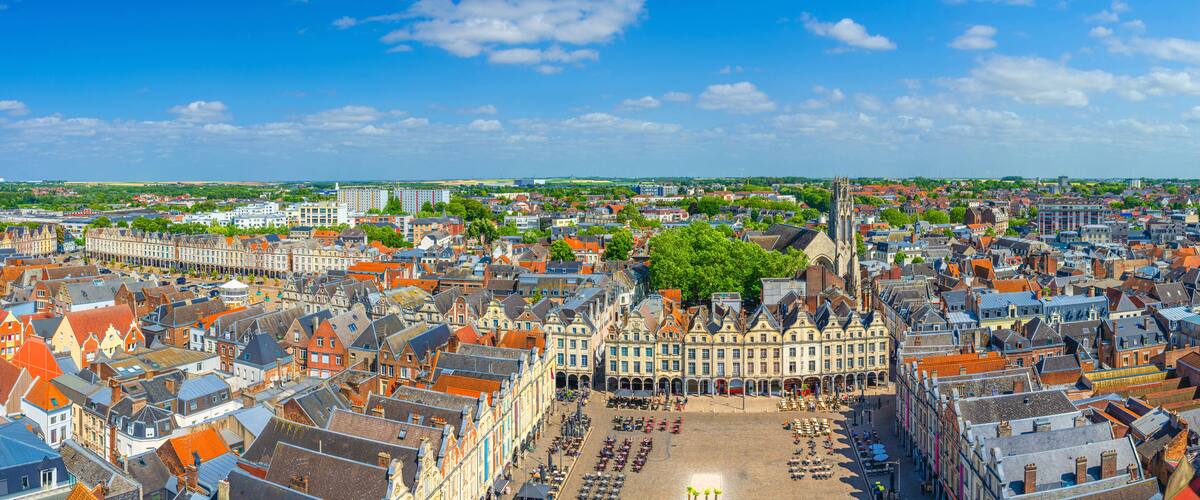 Aerial panoramic view of Arras city historical centre, La Grand Place and La Petite Place des Heros square with Flemish-Baroque-style townhouses buildings, Panorama of Arras old town center, France
