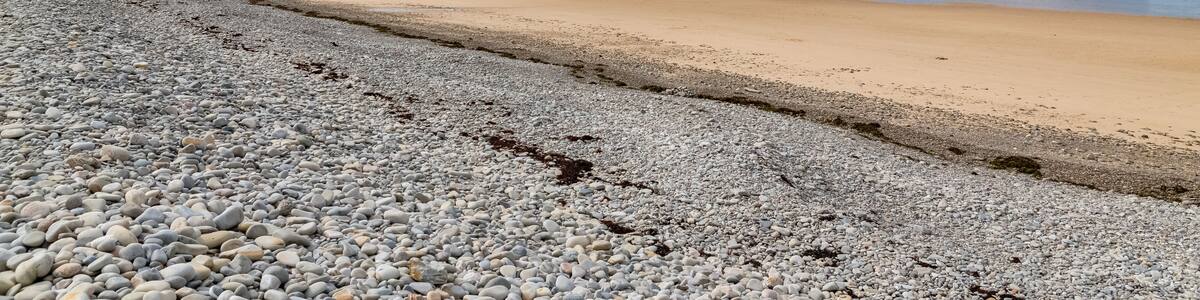 Beautiful beach at Vauville in Normandy, with pebbles