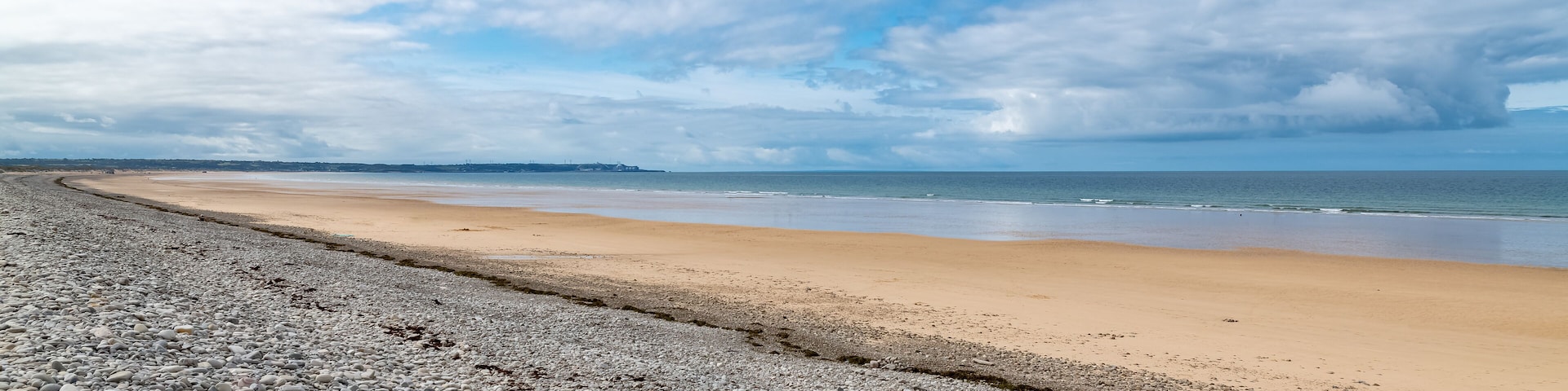 Beautiful beach at Vauville in Normandy, with pebbles