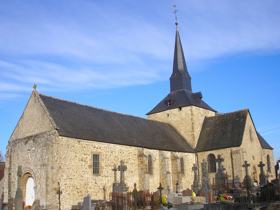 A church with a tall spire and a stone facade.