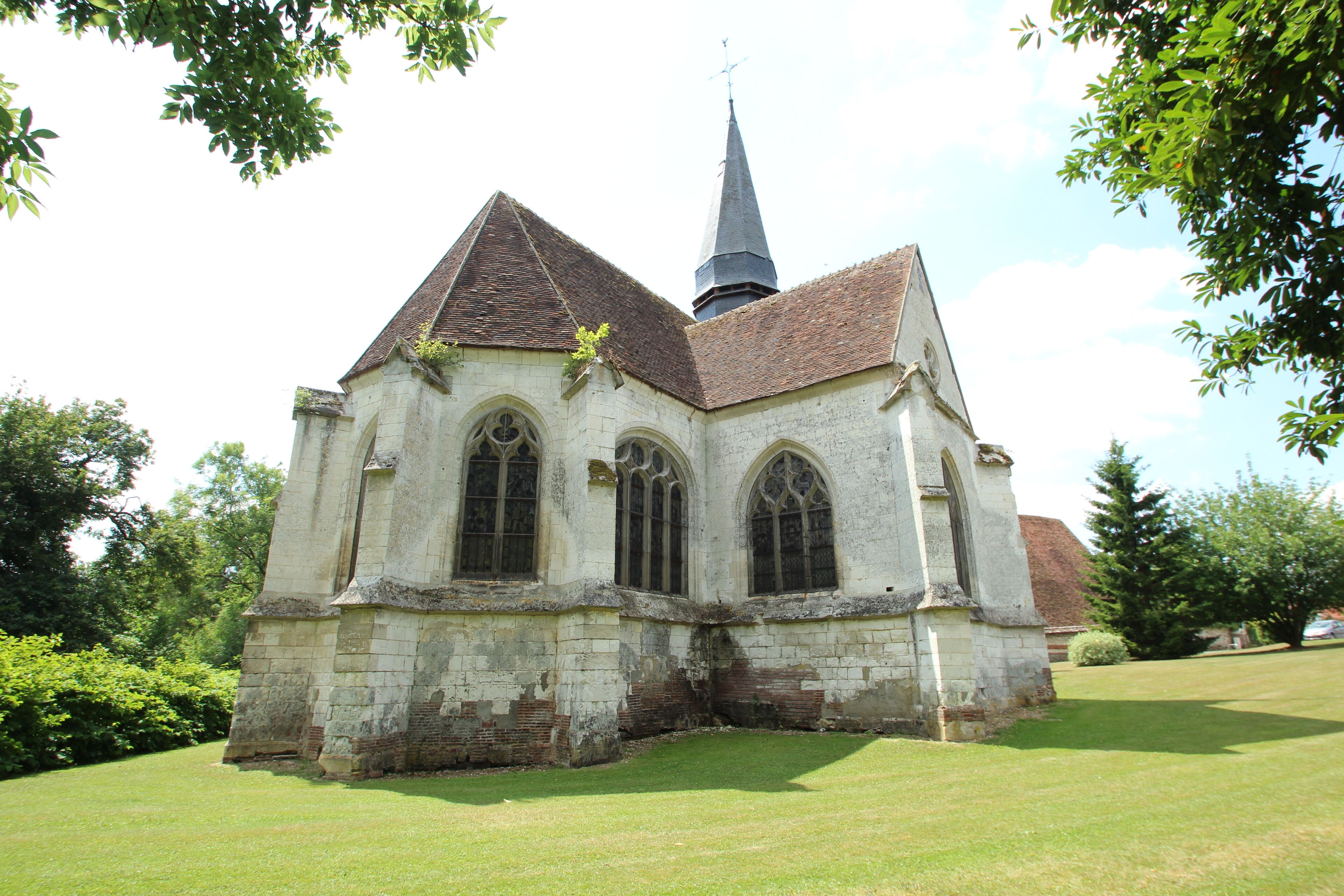 A historic church with a tall steeple and arched windows.