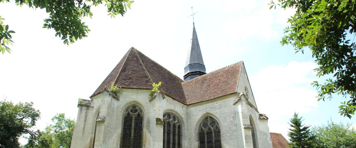 A historic church with a tall steeple and arched windows.
