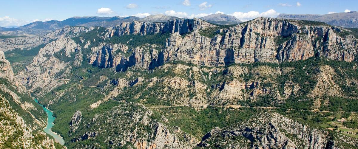 A mountainous landscape with a river winding through the valley.