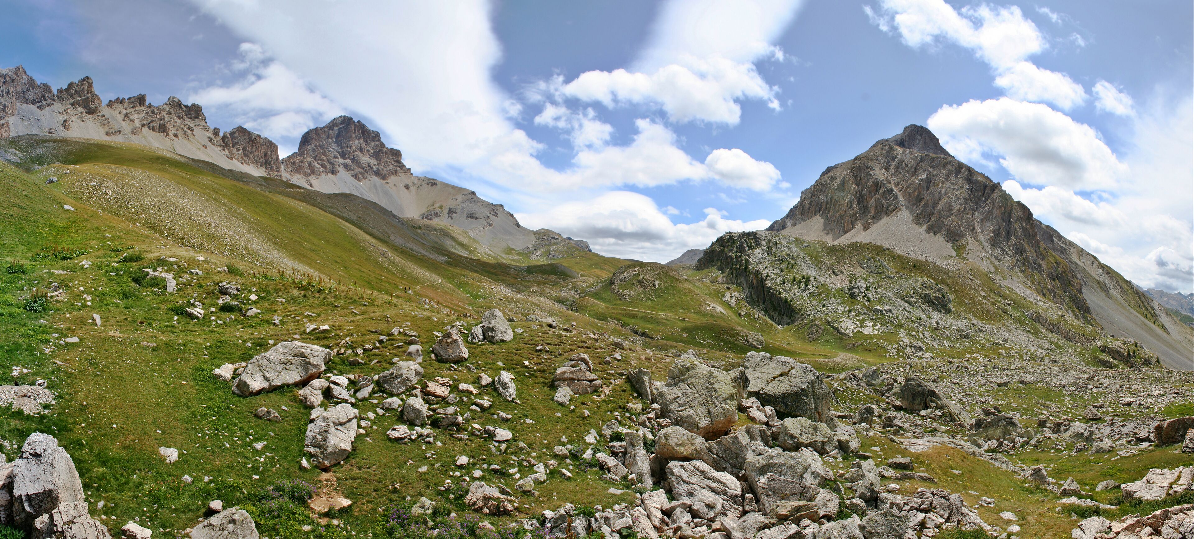 The Orrenaye valley, above the Ubayette Valley, on the French side of the Ubaye Range, in the Alps. Visible features include, from the left to the right: Aiguilles de l'Orrenaye (Litt. Orrenaye's needles), Tête de Moïse (Litt. Mosses Head), Orrenaye Pass, and Tête des Blaves (Litt. Head of the Blaves).