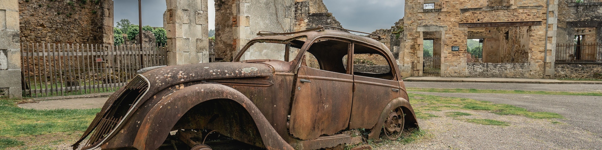 Old rusty cars left behind in Oradour-sur-Gllane, France.