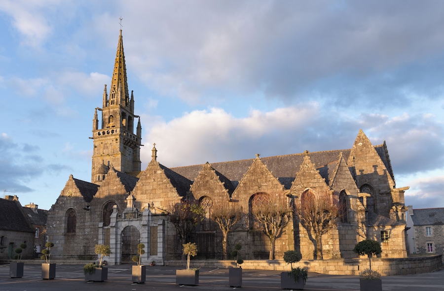 A historic church with a tall spire and multiple pointed towers.