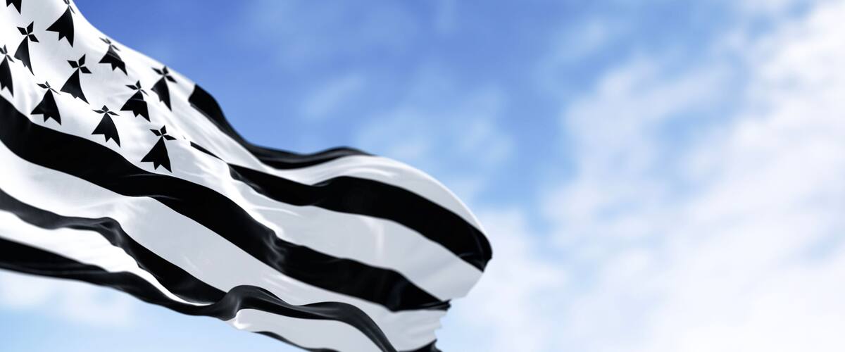 Brittany flag waving with french national flag on a clear day