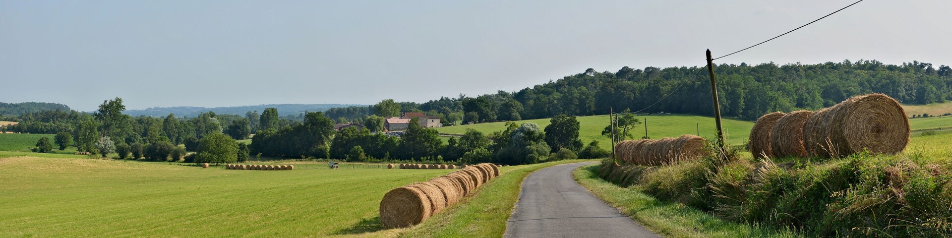 Road D 89 with straw bales. Curac, Charente, France.