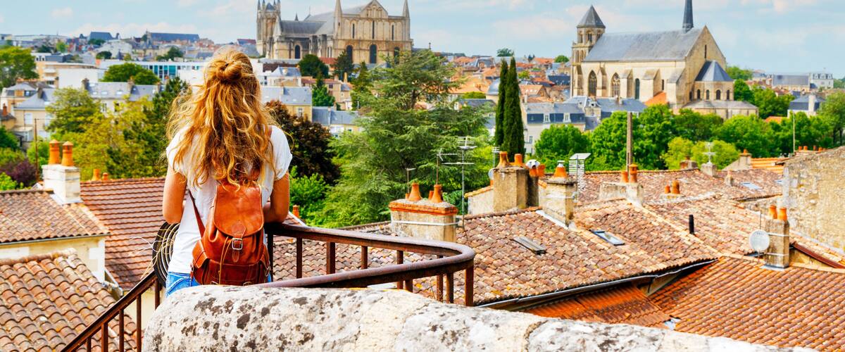 Poitiers city landscape viewpoint- Woman tourist looking at city skyline- vacation, travel destination, tourism in France- Poitou Charente, Vienne