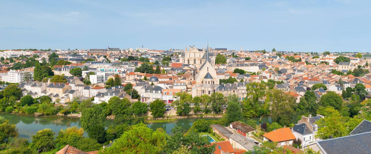 A cityscape with a prominent church and river.