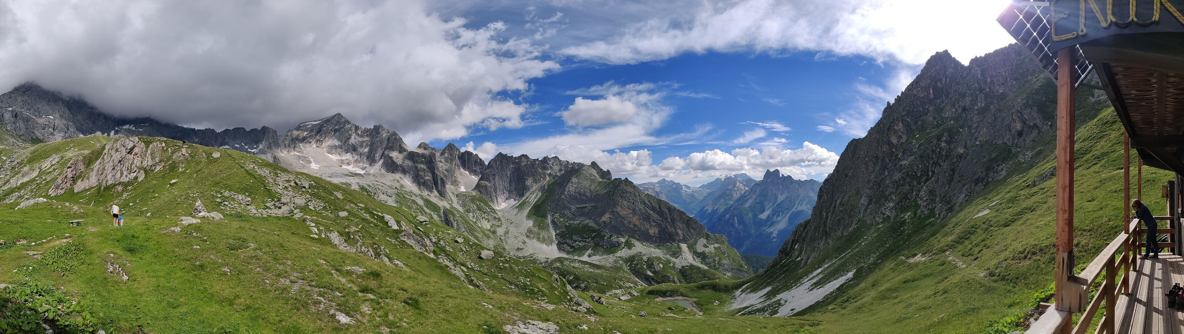 A mountainous landscape with a wooden viewing platform.