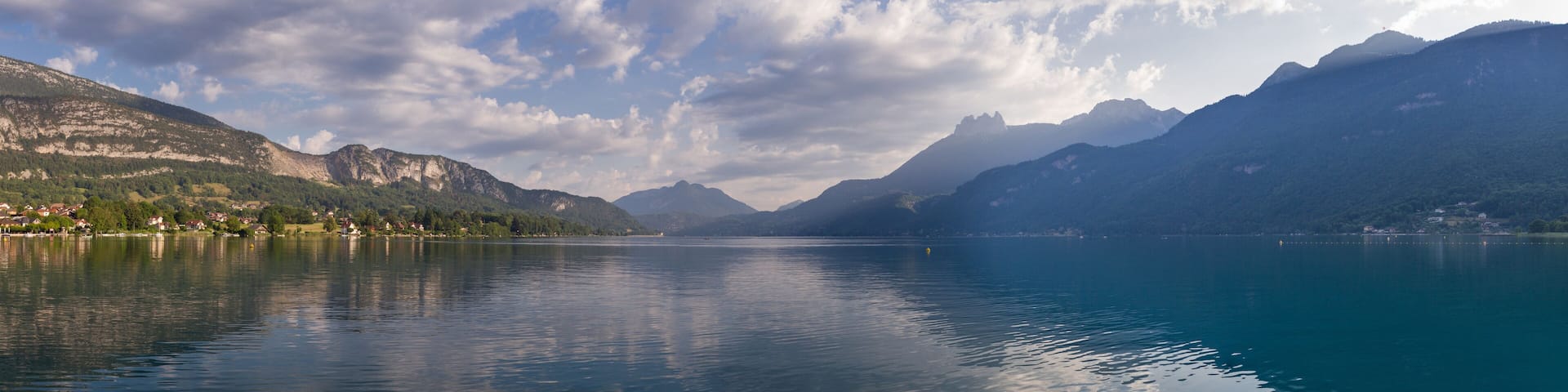panorama of lake annecy in the morning with cloudy sky