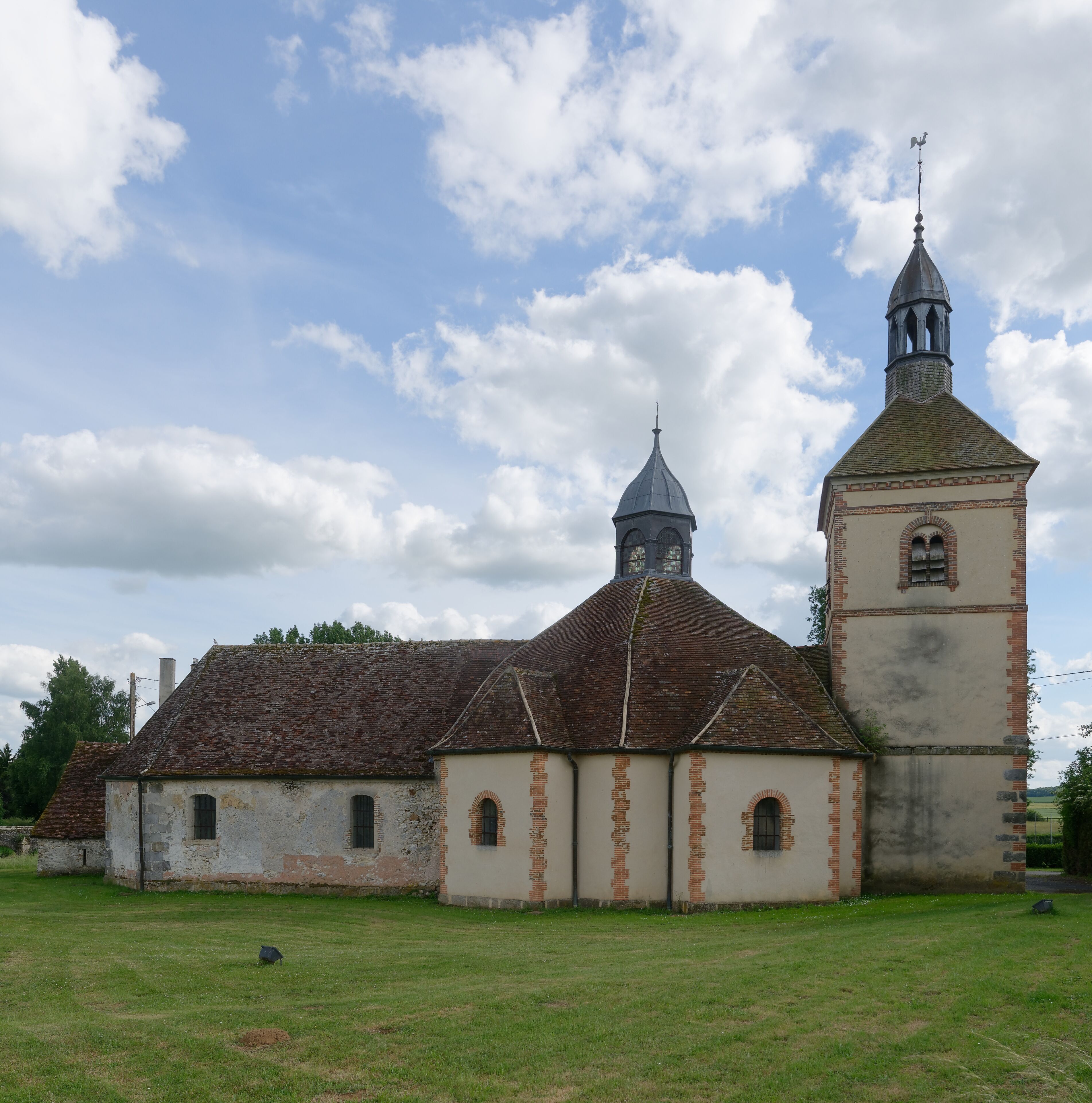 A church with a bell tower and a steeple.