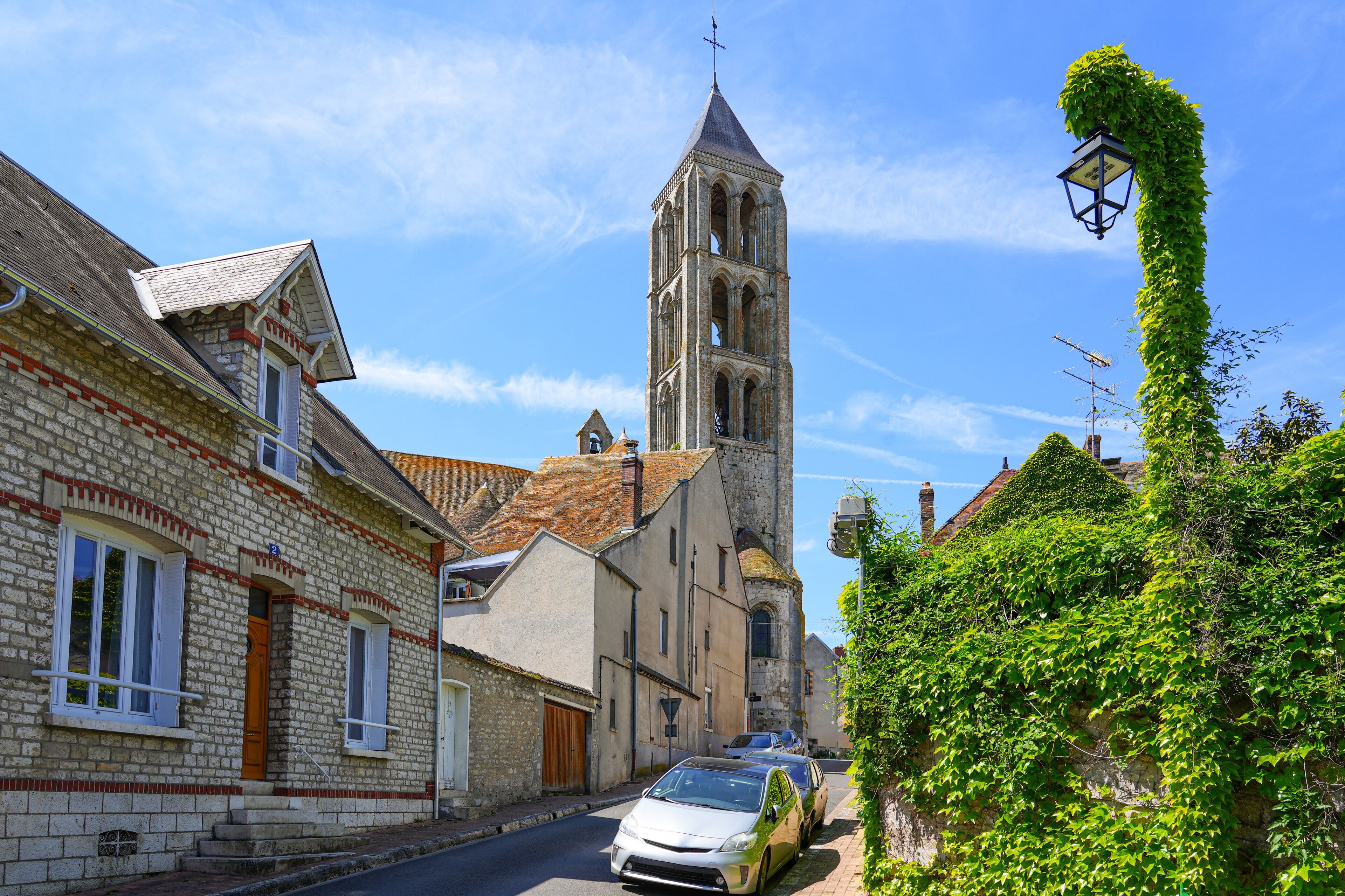 Bell tower of the church of Our Lady of the Assumption in Château-Landon, a rural village of the Gâtinais in Seine et Marne, Paris Region, France