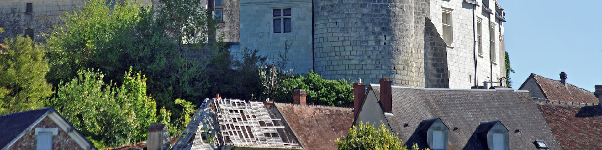 A historic castle with multiple towers and a large stone tower.