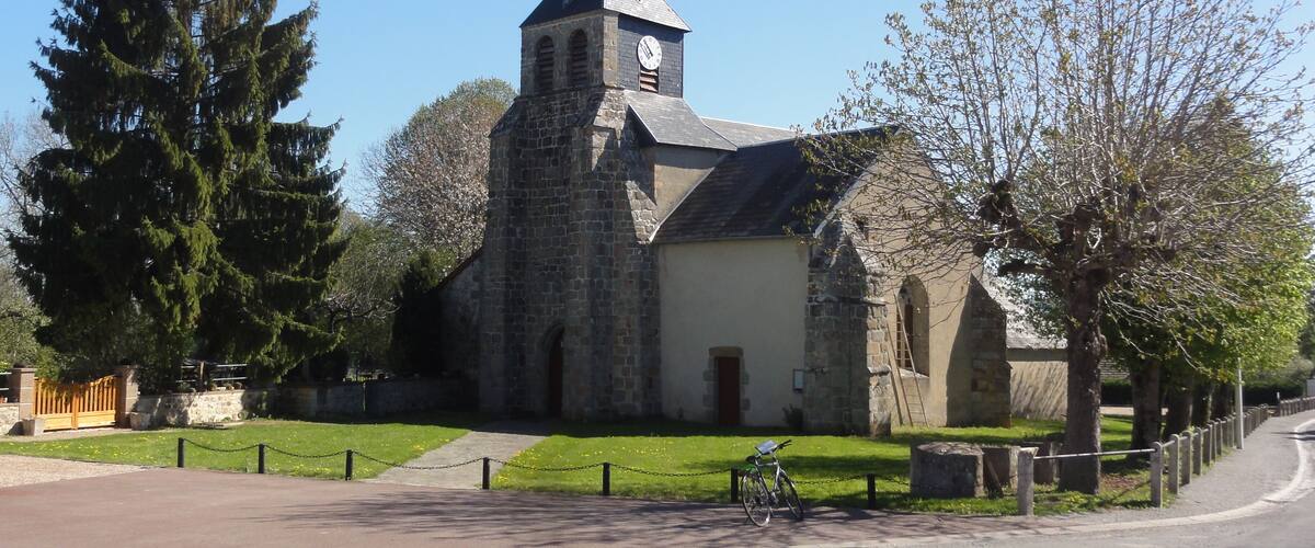 A church with a tall steeple and a clock tower.