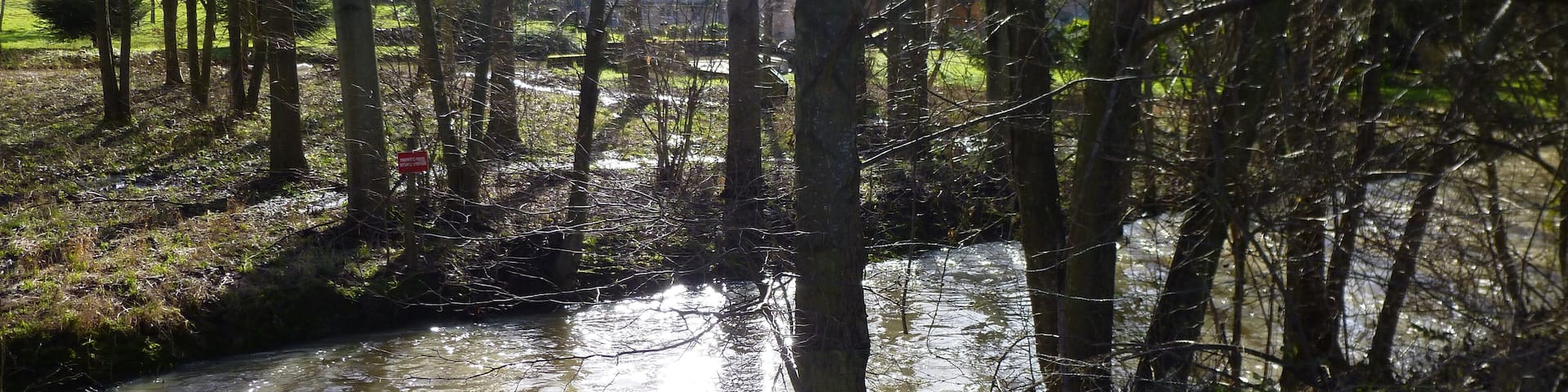 La Chapelle-sur-Aveyron, Loiret, Centre, France. Communal pond, viewed from the west. The Aveyron river just after the communal pond's incoming overflow.