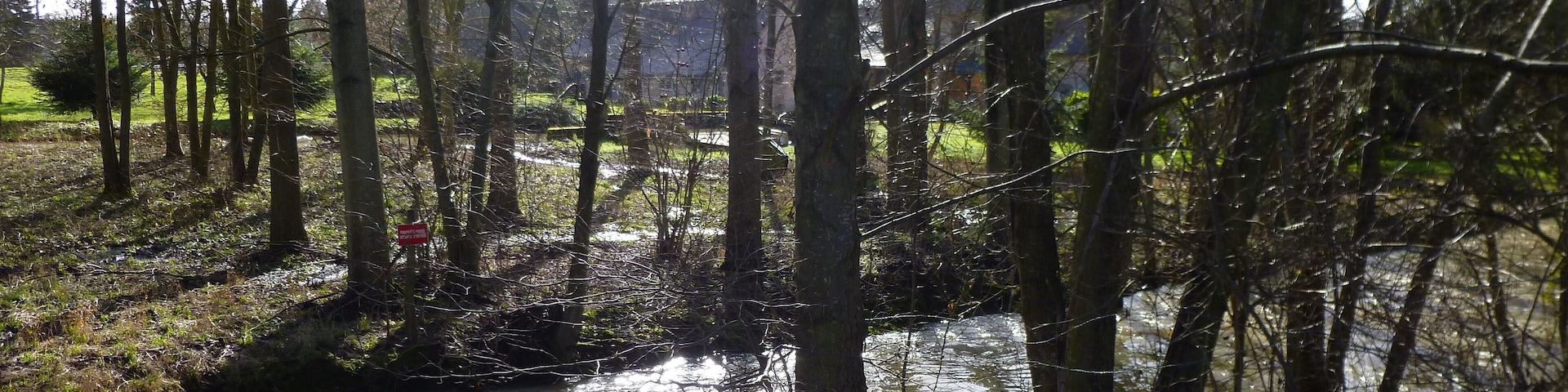 La Chapelle-sur-Aveyron, Loiret, Centre, France. Communal pond, viewed from the west. The Aveyron river just after the communal pond's incoming overflow.