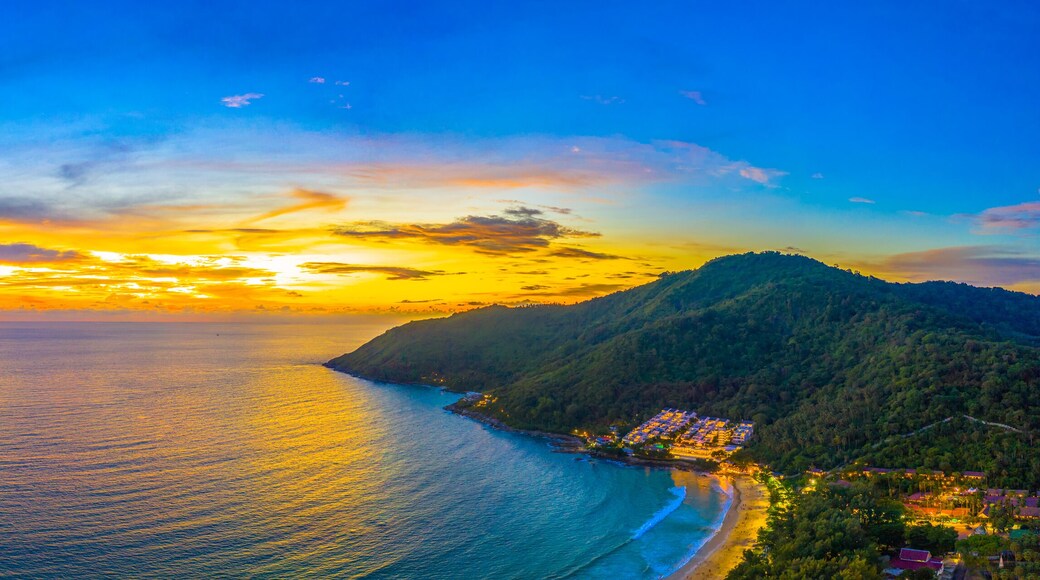 aerial view sunset above Nai Harn beach. Nai Harn beach is a famouse landmark and popular sunset viewpoint of Phuket Thailand..
