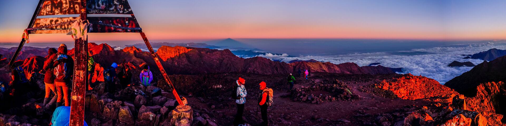 On the summit of Jebel Toubkal, highest mountain in Morocco during sunrise.