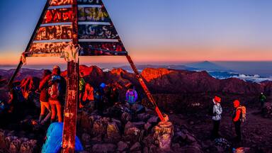 On the summit of Jebel Toubkal, highest mountain in Morocco during sunrise.