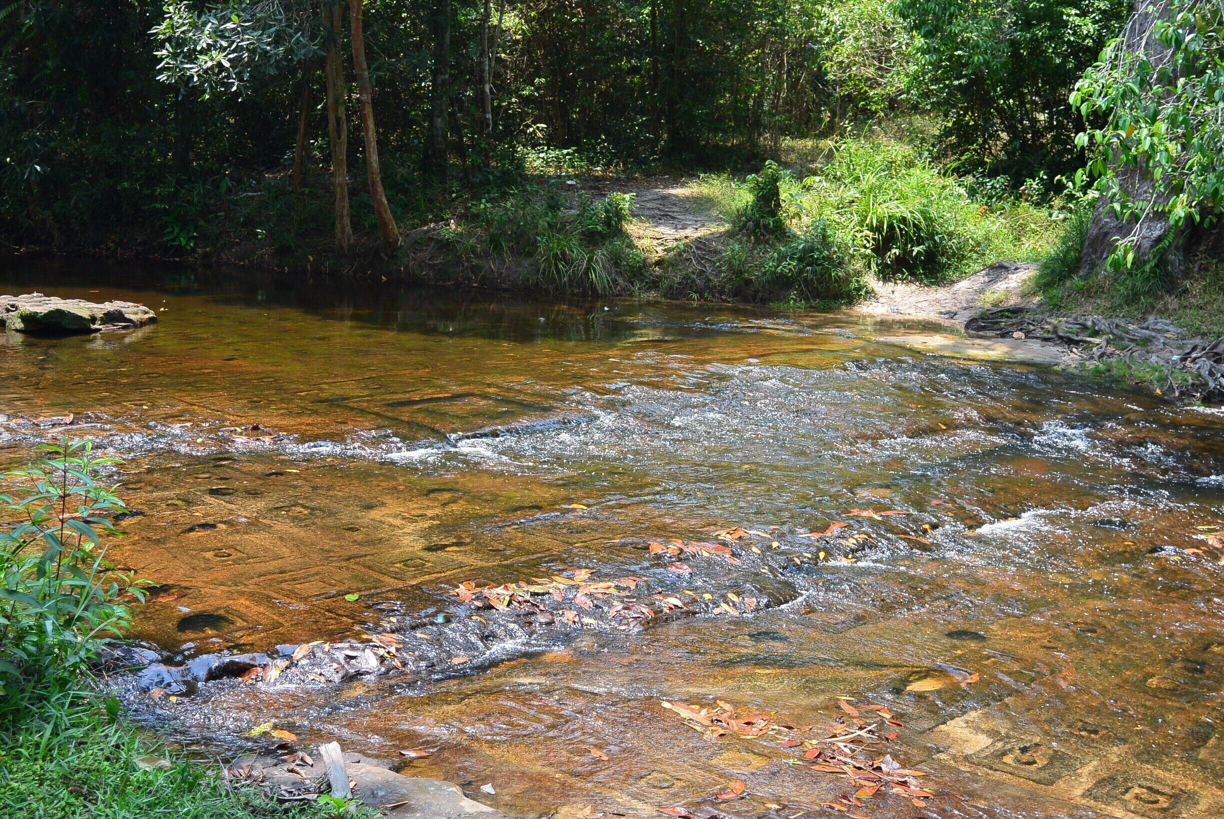 The Kbal Spean archaeological site, also known as "Valley of a thousand Lingas"  is located on the mountain in the National Park. You will see a lot of local kids playing and swimming at this sacred place #NationalPark #wander #waterfall
