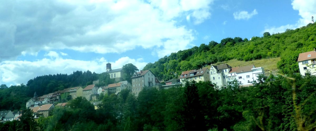 A hillside village with traditional houses and a church.