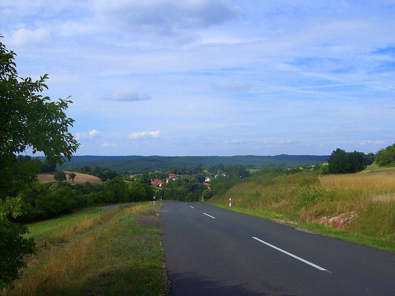 View to the Haßberge hills and the village Neubrunn situated in the valley.