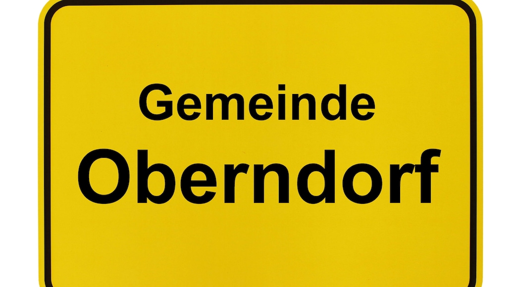 Ein gelbes Schild mit dem schwarzen Schriftzug 'Gemeinde Oberndorf'.